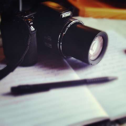 travel journal and camera