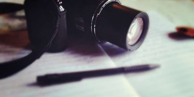 travel journal and camera