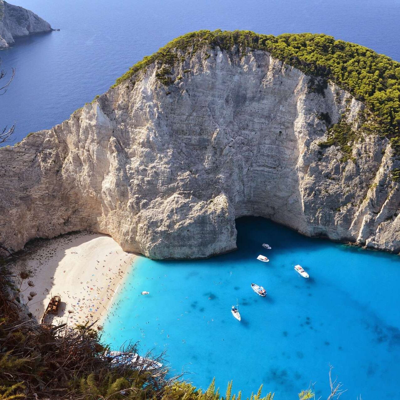 Birds eye view of a greek beach with blue sea