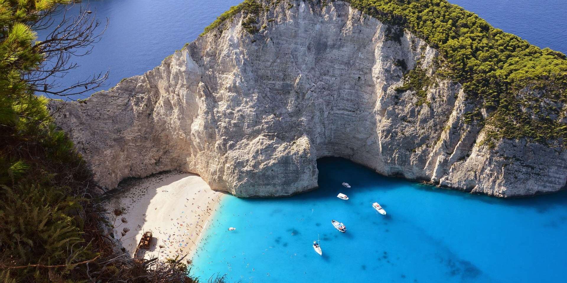 Birds eye view of a greek beach with blue sea