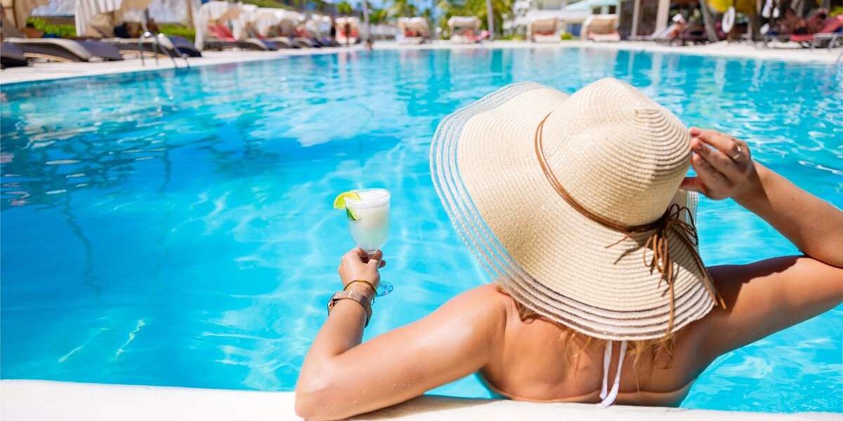 Woman in pool on singles holiday