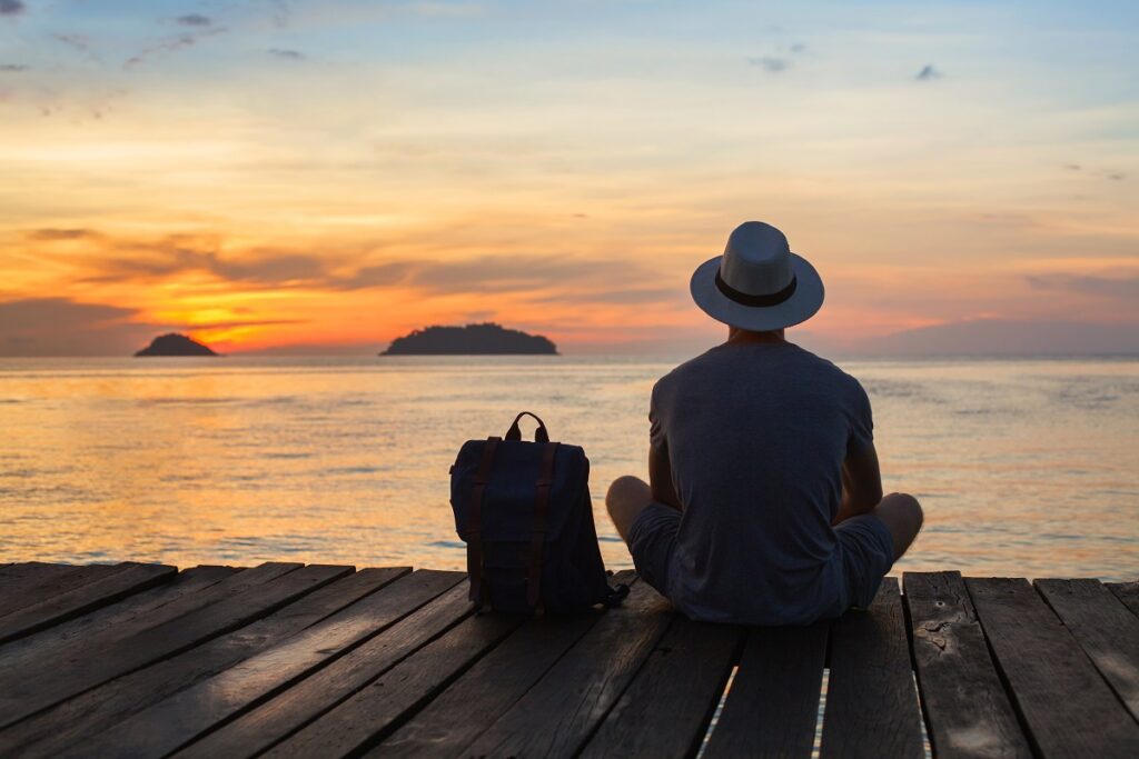 Man looking out at water